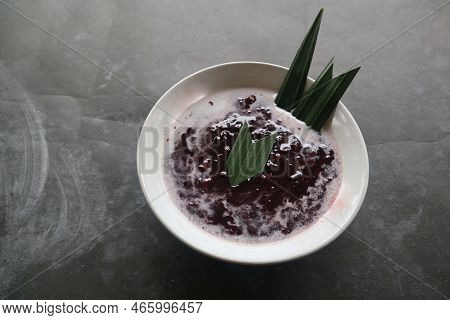 Black Sticky Rice Porridge In A Bowl. Bubur Ketan Hitam