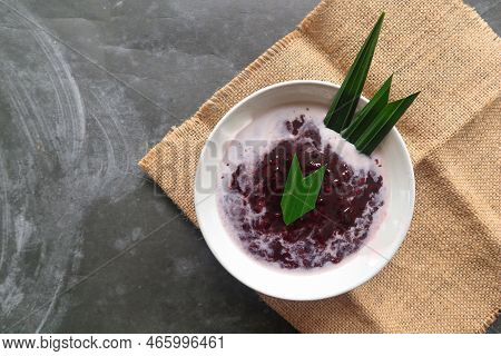 Black Sticky Rice Porridge In A Bowl. Bubur Ketan Hitam