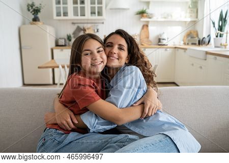 Portrait Of Happy Caucasian Family Single Mother And Teenage Daughter Hugging Cuddling, Spending Tim