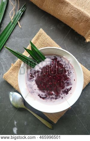 Black Sticky Rice Porridge In A Bowl. Bubur Ketan Hitam
