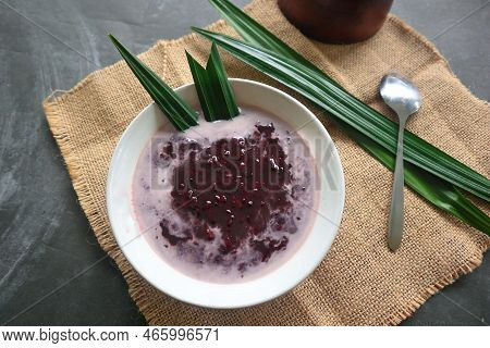 Black Sticky Rice Porridge In A Bowl. Bubur Ketan Hitam