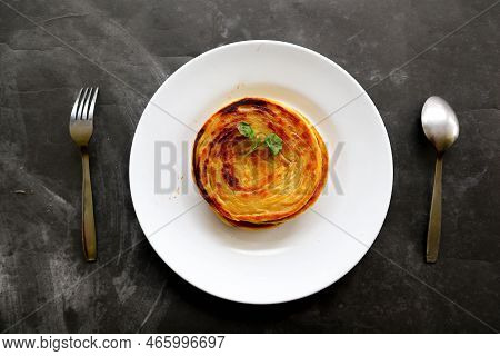 Paratha Bread Or Canai Bread Or Roti Maryam, Favorite Breakfast Dish. Served On Plate