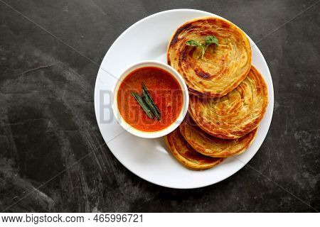 Paratha Bread Or Canai Bread Or Roti Maryam, Favorite Breakfast Dish. Served On Plate