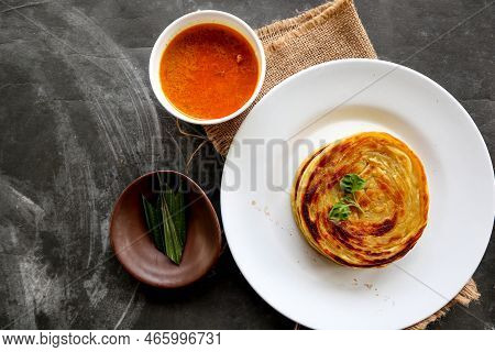 Paratha Bread Or Canai Bread Or Roti Maryam, Favorite Breakfast Dish. Served On Plate