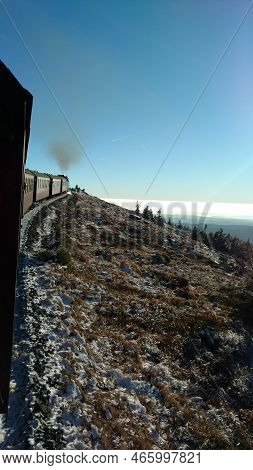 Brocken Steam Locomotice Running Up Hill Winter Blue Sky