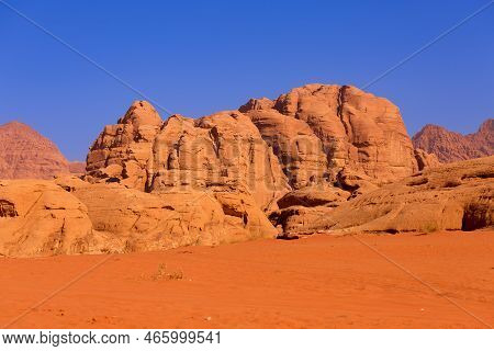 Wadi Rum Desert With Orange Sand And Rock Formations In Jordan, Middle East