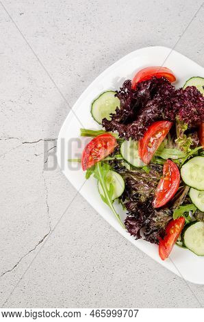Healthy Vegetable Salad With Fresh Salad Leaves, Arugula, Cherry Tomato, Cucomber And Parsley In Pla