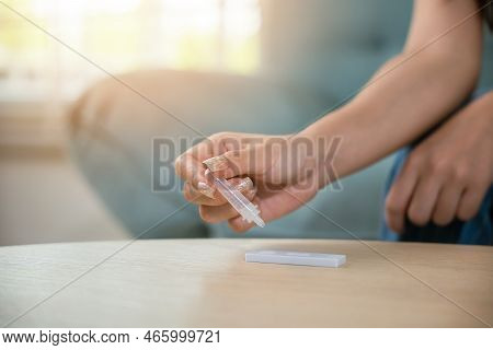 Close Up Woman Hands Using Rapid Antigen Test Kit For Selftest, Female Four Drops Of Liquid To Perfo