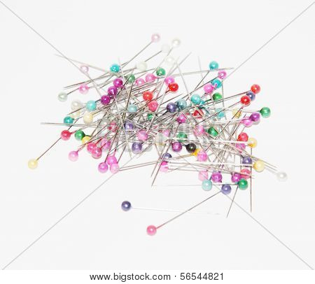 Bunch Of Safety Pins With Colored Circular Heads For Sewing.