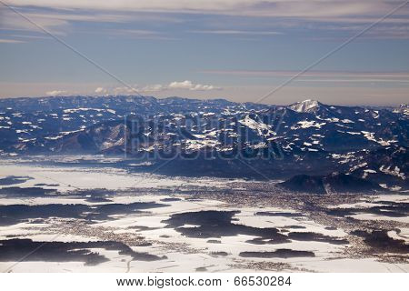 Mountains in a winter and a city (Alps and city Kranj, Slovenia)