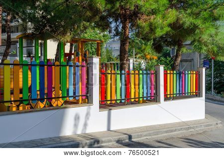 Greece, Halkidiki, Bright Multicolored Fence On The Street In Nea Kallikratia