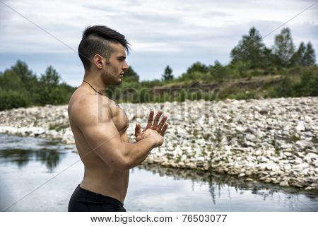 Muscular Shirtless Young Man Outdoor Concentrated