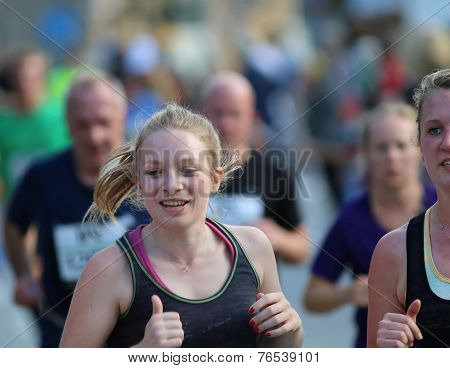 Smiling Blonde Woman Running