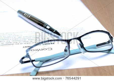 Siver Pen On The Contract Papers, Glasses Above