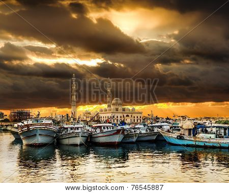 Fishing Boats At The Port Of Hurghada, Hurghada Marina At Sunset Against The Mosque