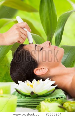 Woman Getting A Face Treatment