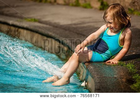 Little girl in a public pool for kids