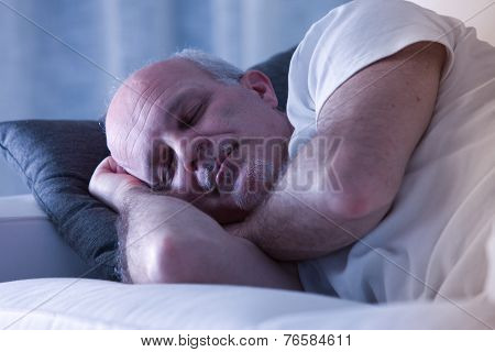 Man Sleeping On His Couch