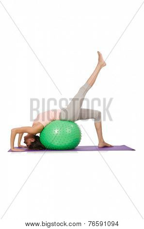 Young woman exercising with swiss ball