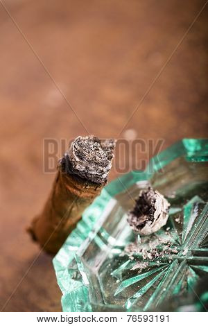 Expensive Hand-rolled Cigar On A While Background