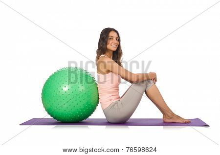 Young woman exercising with swiss ball