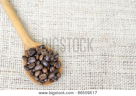 Wooden Spoon Full With Roasted Coffee Beans