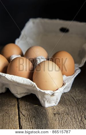 Fresh Eggs In Egg Box In Moody Natural Lighting Vintage Retro Style Set Up
