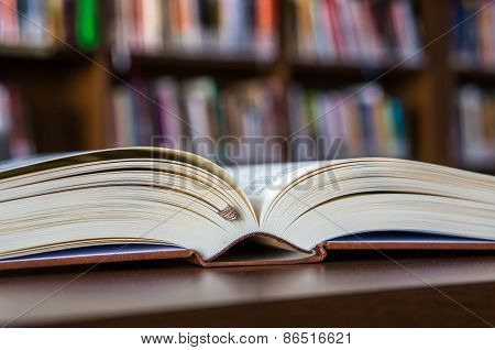 Open Book On The Table In Library