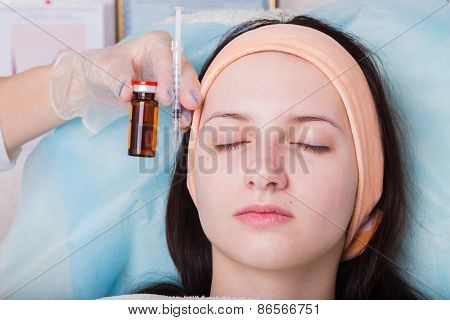 Subcutaneous injection into the girl's face.