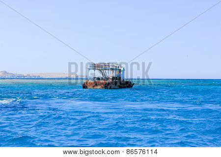 Old Rusty Barge Floating On The Sea