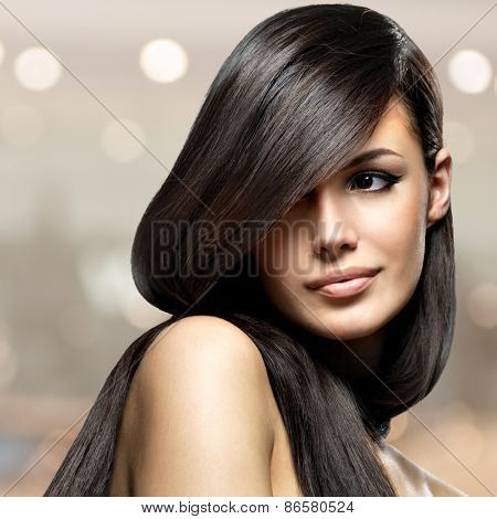 Beautiful woman with long straight hair. Fashion model posing 