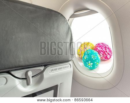 Image Of Easter Egg And  Fasten Seat Belt While Seated Sign On Airplane .