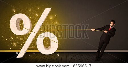 Business man pulling rope with big procent symbol sign concept on background