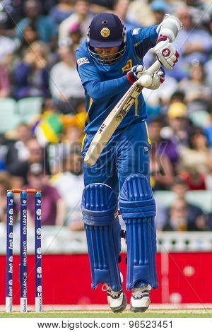 LONDON, ENGLAND - June 17 2013: Sri Lanka's Mahela Jayawardene gets hit on the hand during the ICC Champions Trophy international cricket match between Sri Lanka and Australia.