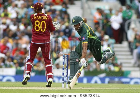 LONDON, ENGLAND - June 07 2013: Pakistan's Wahab Riaz runs a single during the ICC Champions Trophy cricket match between Pakistan and The West Indies at The Oval Cricket Ground.