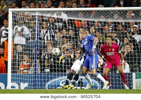 LONDON, ENGLAND. September 19 2012  Chelsea's Fernando Torres heads the ball  as Juventus's Gianluigi Buffon watches on during the UEFA Champions League football match between Chelsea and Juventus
