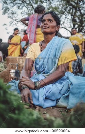 KAMALAPURAM, INDIA - 02 FABRUARY 2015: Indian woman sells vegatables on a market close to Hampi. Post-processed with grain, texture and colour effect.