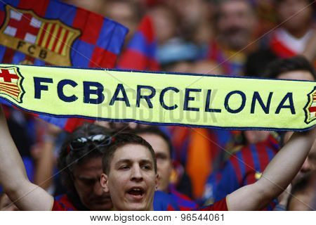 LONDON, ENGLAND. May 28 2011: A fan with a Barcelona scarf during the 2011UEFA Champions League final between Manchester United and FC Barcelona, at Wembley Stadium