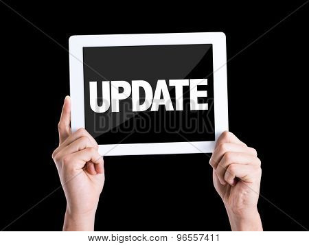Tablet pc with text Update isolated on black background