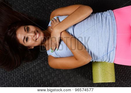 Woman using a foam roller after a workout