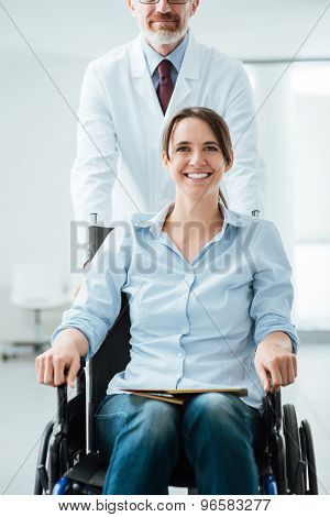 Doctor Pushing A Patient In Wheelchair