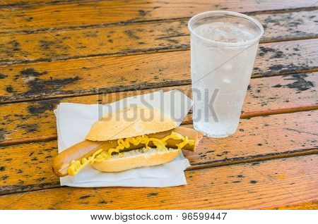 Sausage, Mustard In Sandwiches And Mineral Water