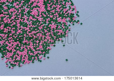 Polymeric dye. Plastic pellets. Colorant for plastics. Pigment in the granules.  Polymer beads