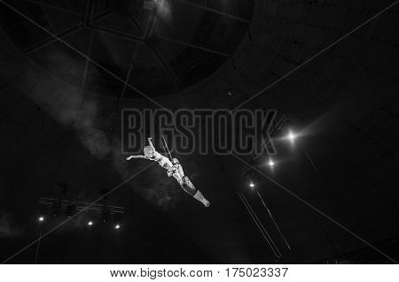 Stunt aerialists men and women in the circus. Love, danger, and romance concept.
