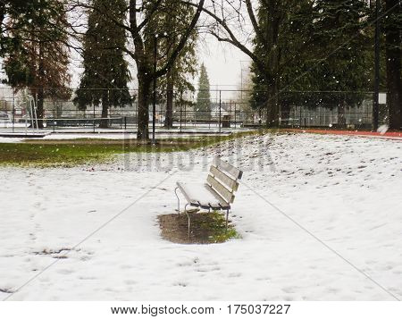 British Columbia, Canada-March 19 2017: Bench Park in the snowy day