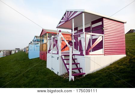 colored beach huts on the beach of Tankerton near Whitstable in Kent, UK