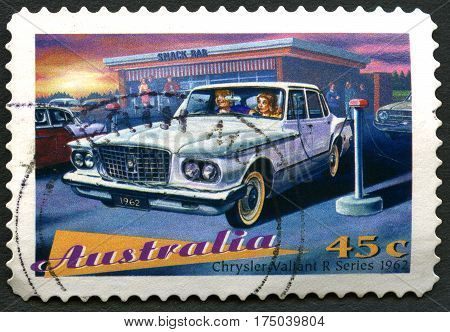 AUSTRALIA - CIRCA 1997: A used postage stamp from Australia depicting an illustration of a Chrysler Valiant R Series 1962 automobile circa 1997.