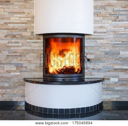 An interior shot of a modern marble fireplace in living room