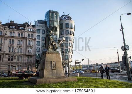Prague Czech Republic 11.04.2014: Dancing House and the monument of Alois Jirasek