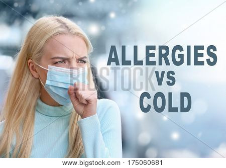 Text ALLERGIES VS COLD on background. Sick woman in facial mask, outdoor